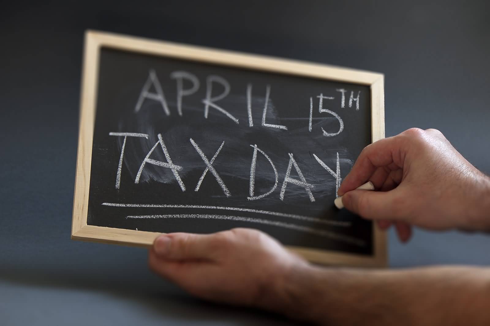 April 15th Tax Day Written On Black Board