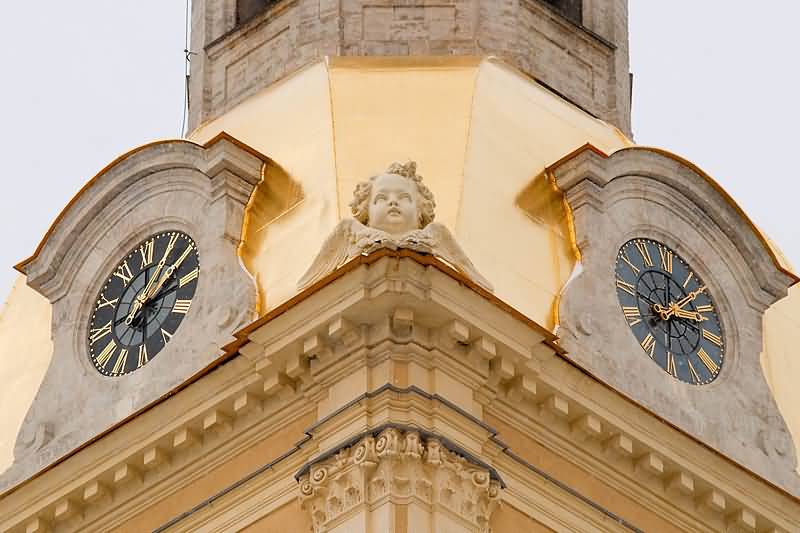 Clock And Statue Of Cherub At The Peter And Paul Cathedral