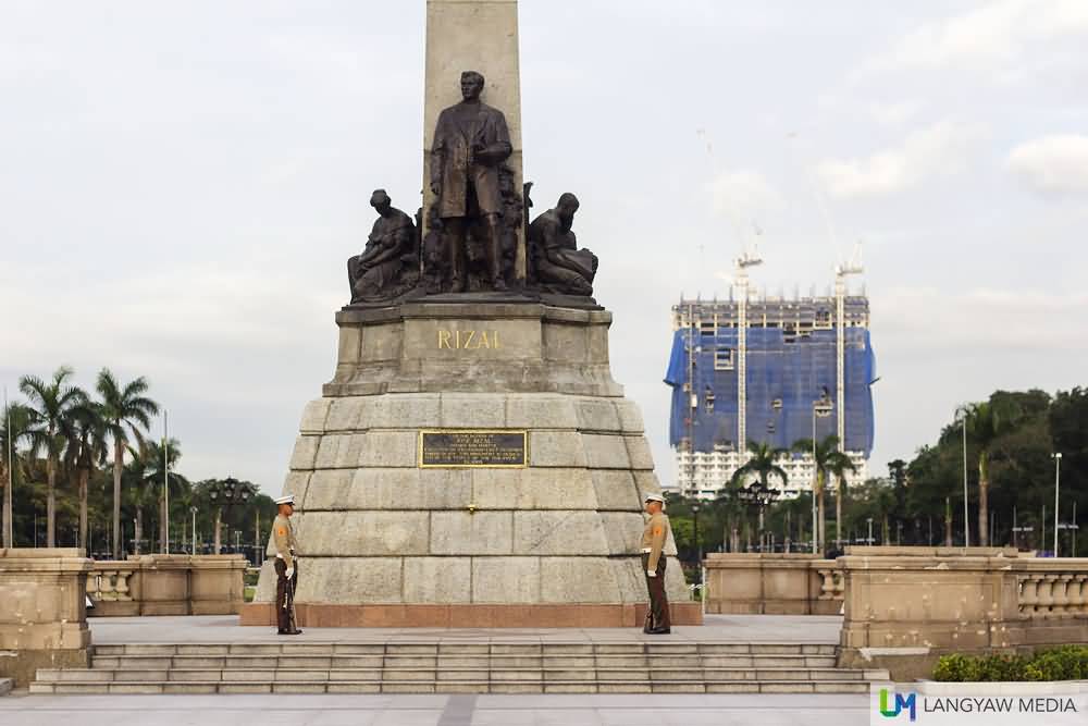 Closeup Of Rizal Monument With The Controversial DMCI Building