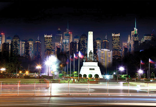 Night View Of Manila Skyscrapers From Rizal Park