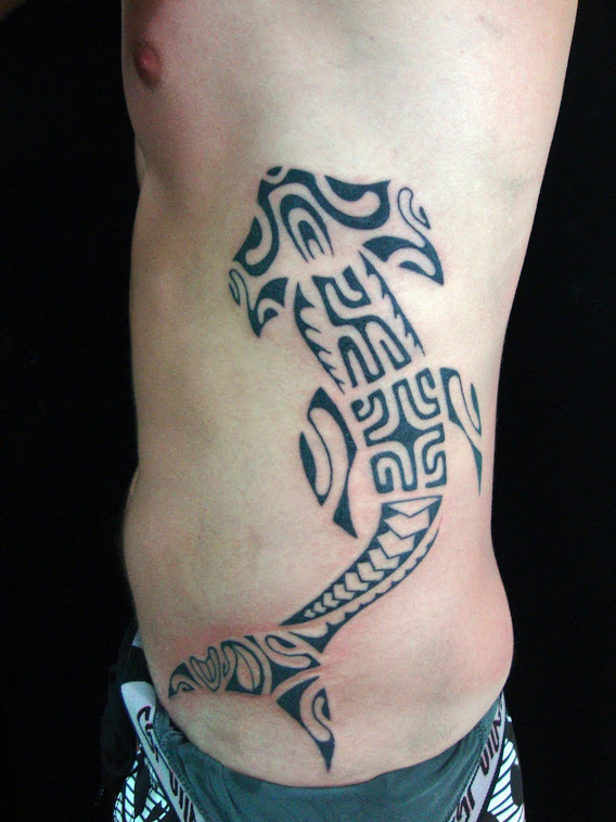 Amazing Black Maori Hammerhead Shark Tattoo On Man Left Side Rib