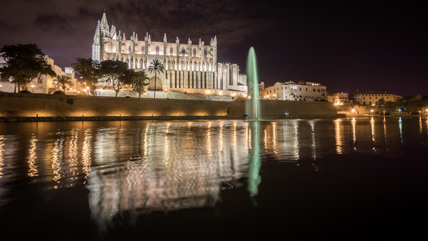 Reflection Of Palma Cathedral In Lake Water At Night