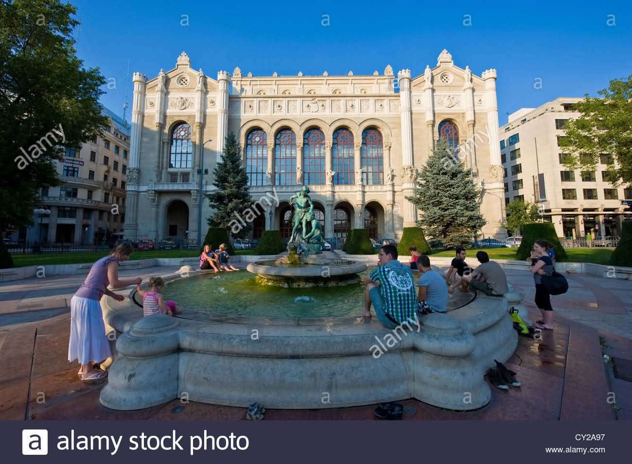 People Sitting Near The Fountain In Front Of Vigado Concert Hall