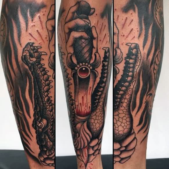 Black Ink Sword In Alligator Tattoo Design For Leg