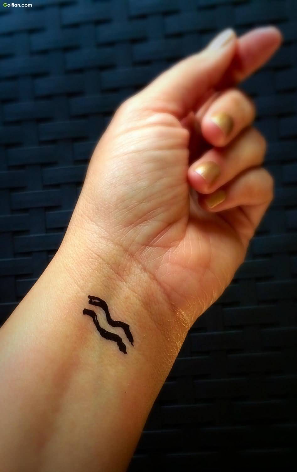 Black Outline Aquarius Symbol Tattoo On Left Wrist