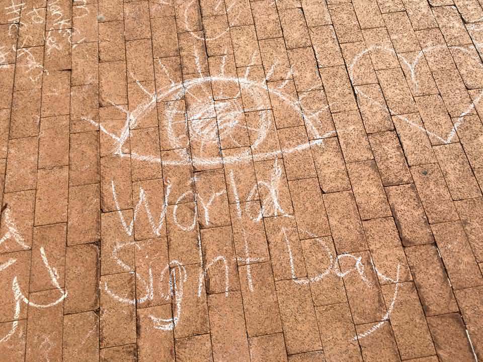 World Sight Day Written On Floor With Chalk