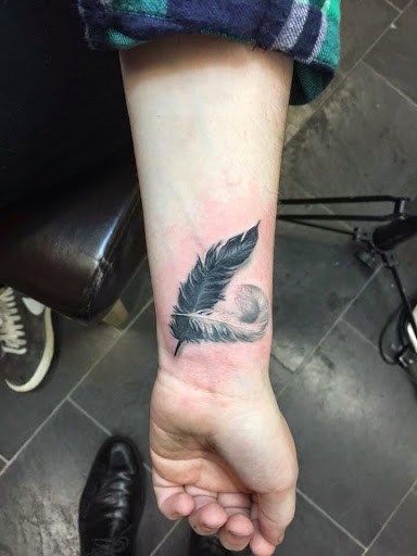 Two Feathers Tattoo On Wrist