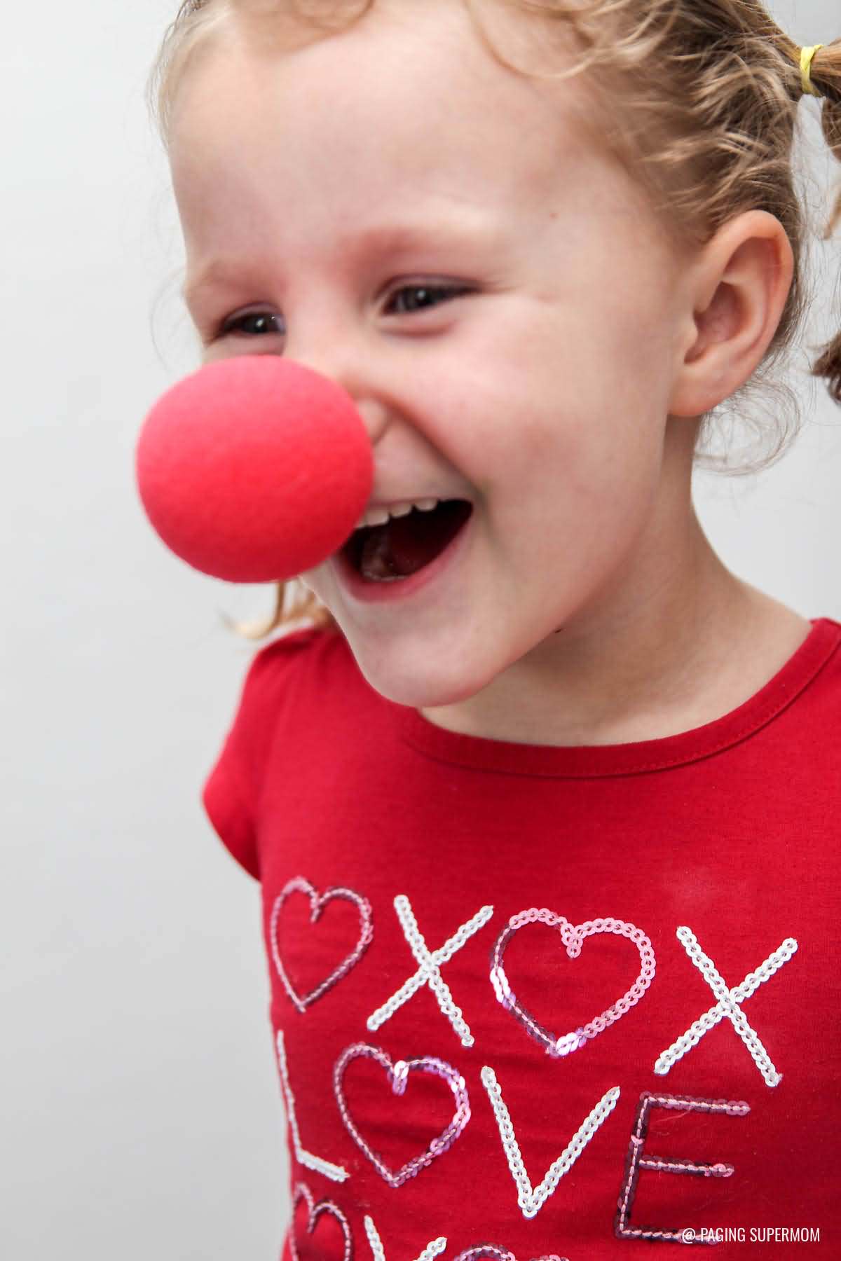 kid with circus clown nose picture