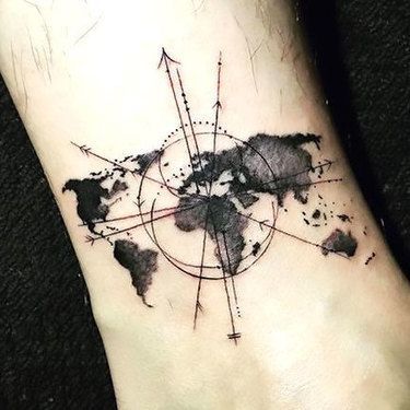 Black globe and compass tattoo with direction and map on arm