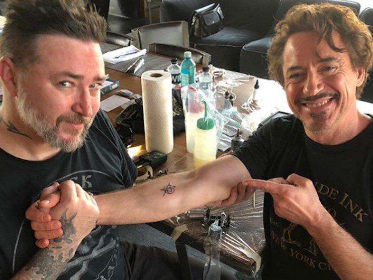 Black avengers infinity war tattoo on inner forearm of Robert Downey Jr