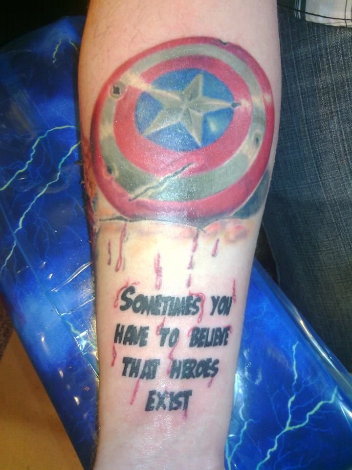 Colored avengers star logo tattoo on inner forearm