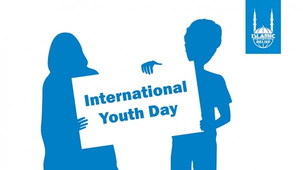 silhouette young kids with International Youth Day banner