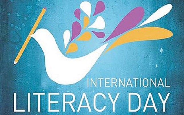 International Literacy Day dove with pencil