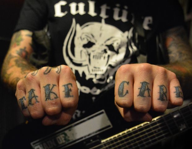 Black and blue take care knuckle tattoo for men