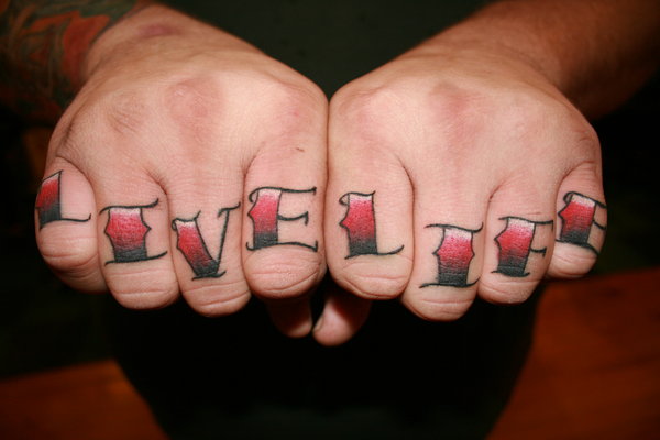 Black and red live life knuckles tattoo by Yeahgregtats