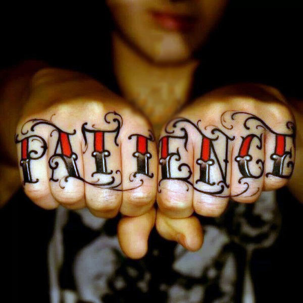 Black and red patience texted knuckle tattoo