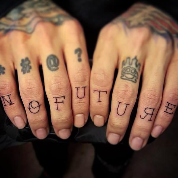 Black letters and signs knuckle tattoo