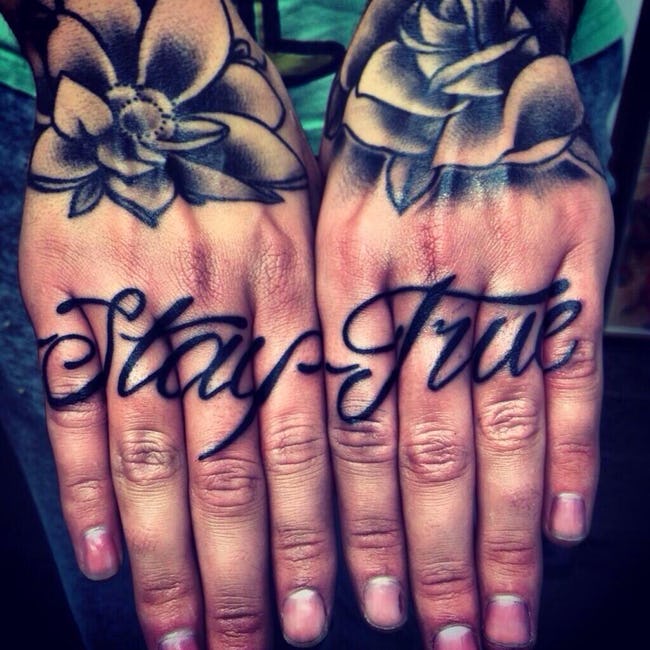 Black stay true texted knuckle tattoo