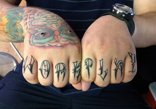 Black work play wording knuckle tattoo