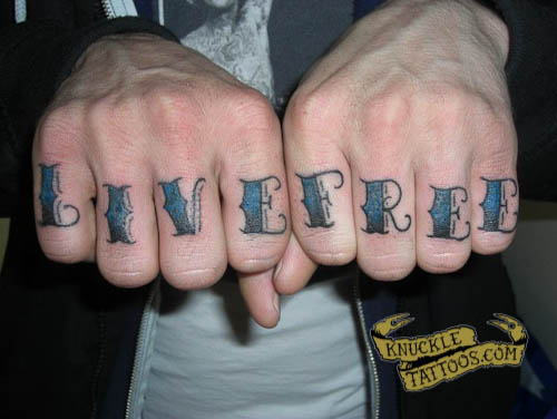 Blue and black live free wording knuckle tattoo