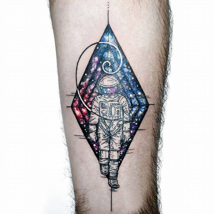 Colored astronaut with universe tattoo on body