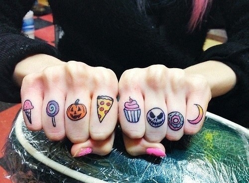 Colorful Halloween knuckle tattoo for women