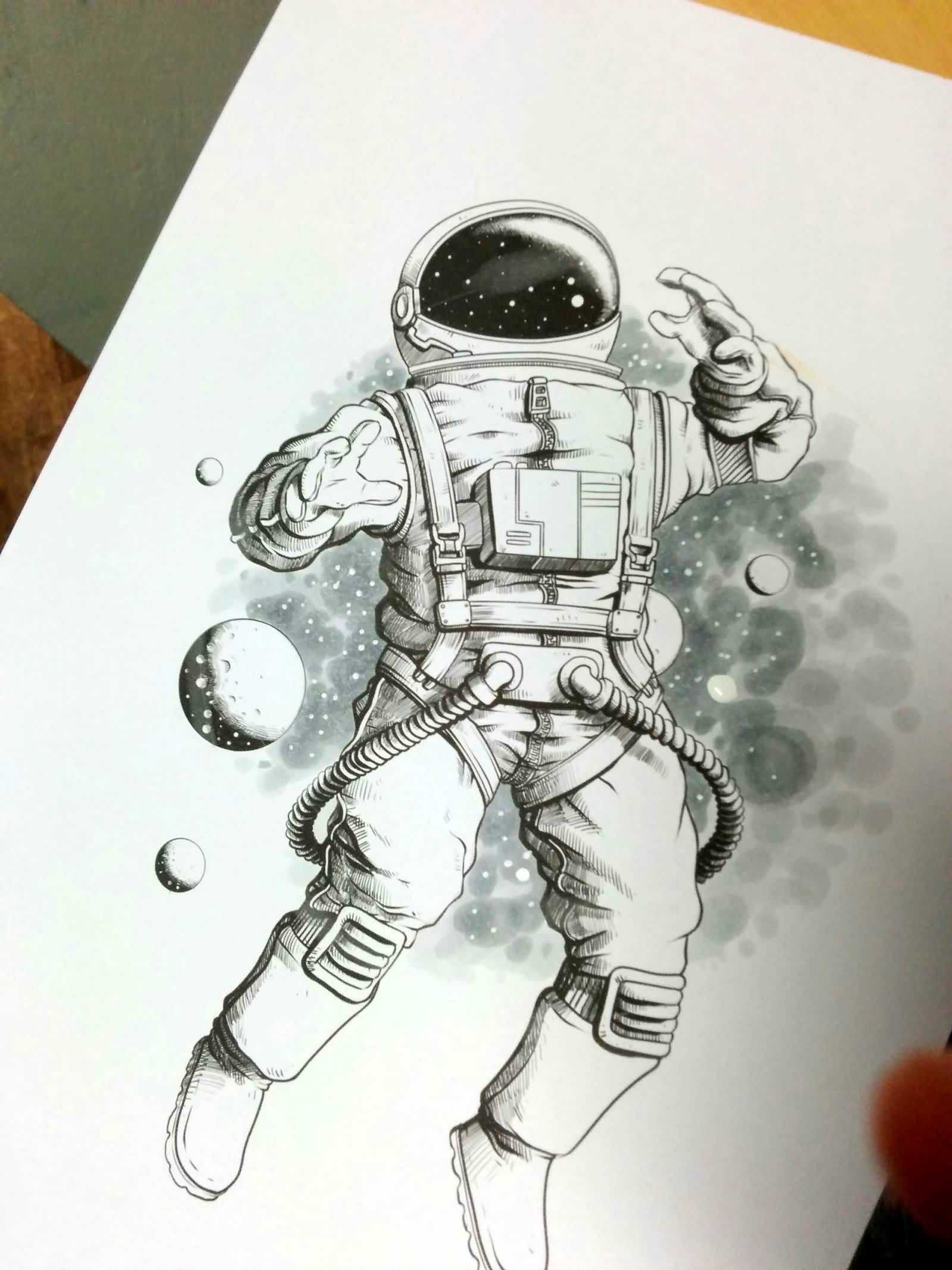 Monochrome astronaut with universe tattoo design