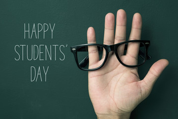 happy students eye glasses on hand