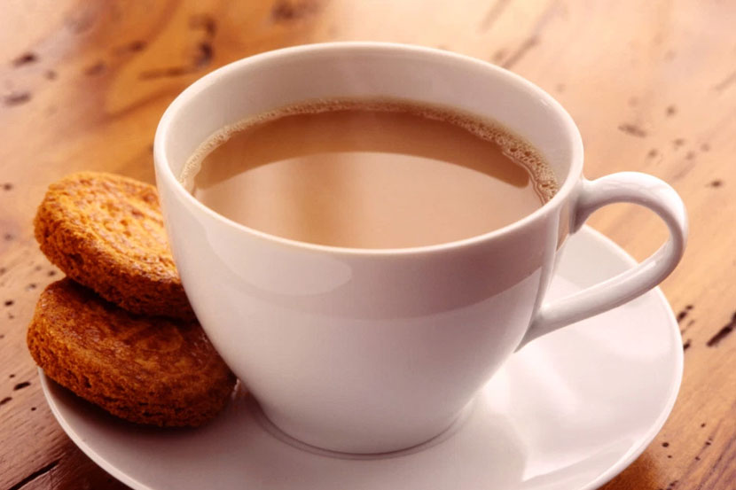 happy International Tea Day cup of tea with cookies