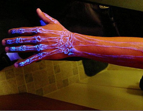 Back light Skeleton Hand Tattoo